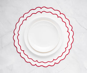 Stylish red and white placemats made of soft cotton cloth, dining setup
