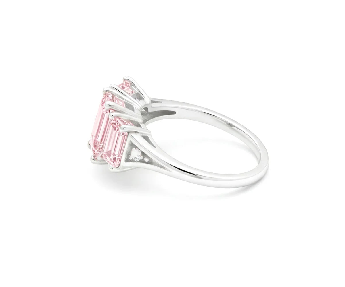 Elegant rose quartz ring featuring white zircon stones with shine