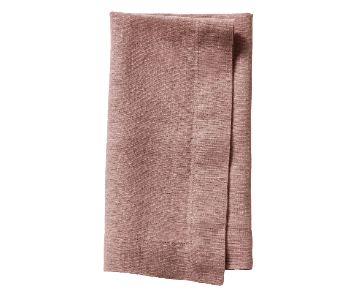 Rosewood plain linen napkin with elegant reddish-brown tone, folded for dining setup
