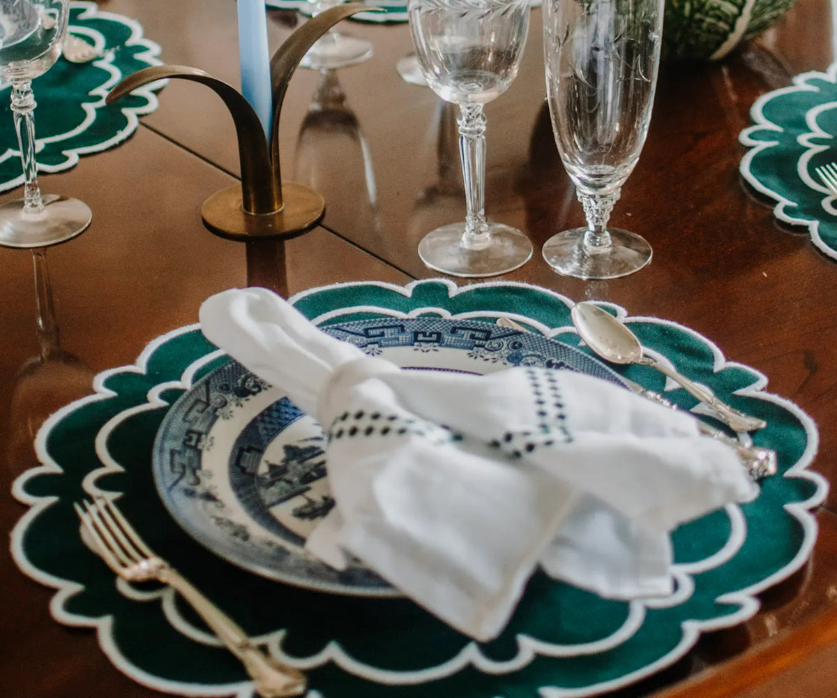 Green and white scalloped placemats