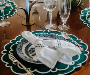 Green and white scalloped placemats