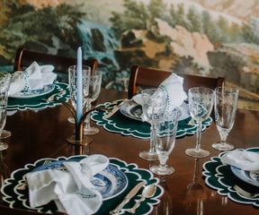 Green and white scalloped placemats with napkins