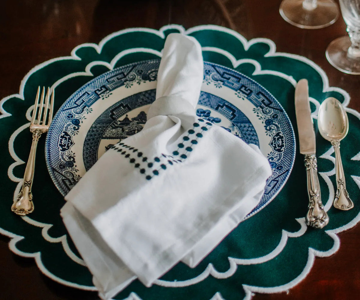 Green and white placemats with green embroidery napkins