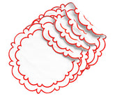 Set of round white placemats featuring red embroidered borders