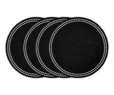 Round black cotton placemat with embroidered dot trim on dining table