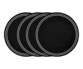 Round black cotton placemat with embroidered dot trim on dining table