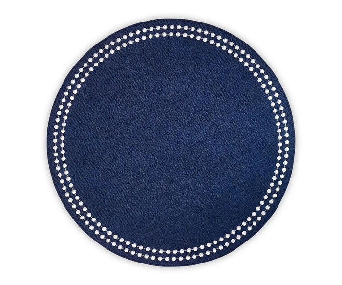 Close-up of embroidered dot trim on 100% cotton navy blue round placemat