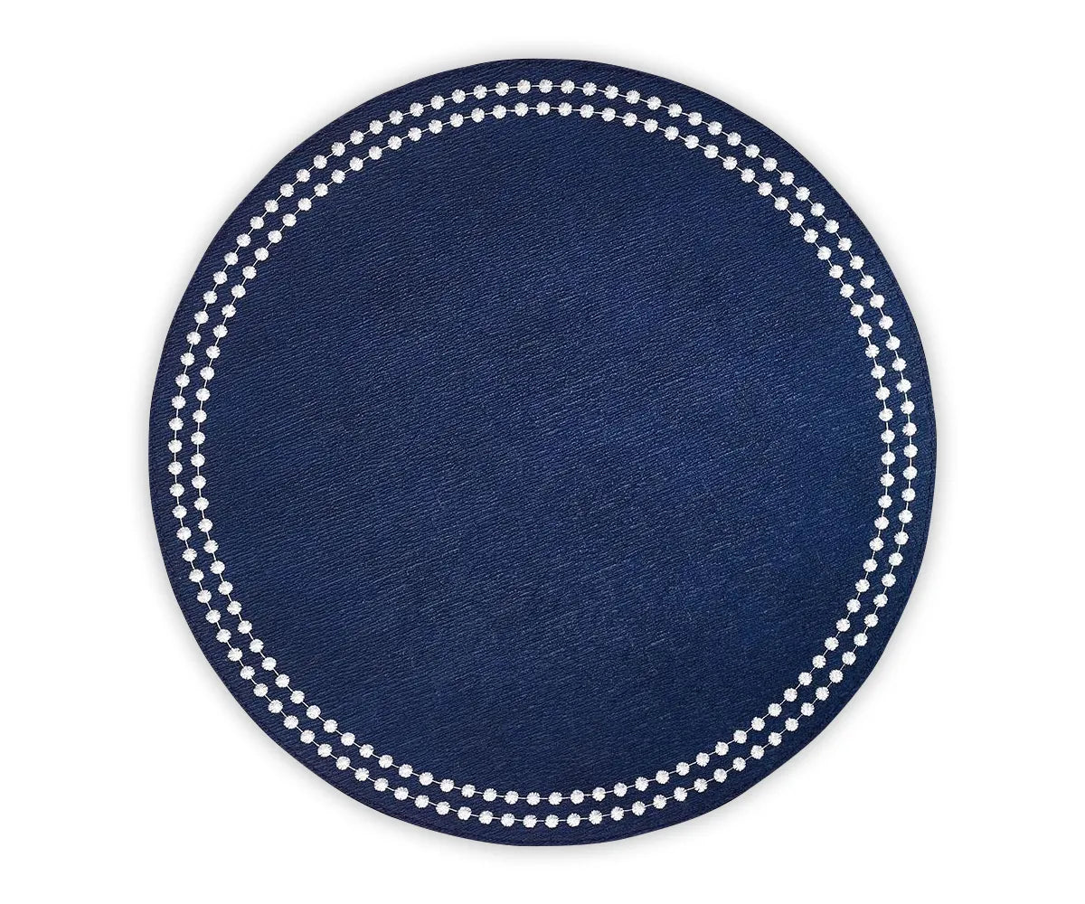 Close-up of embroidered dot trim on 100% cotton navy blue round placemat