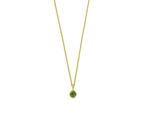 Close-up of 14K gold peridot pendant on adjustable chain
