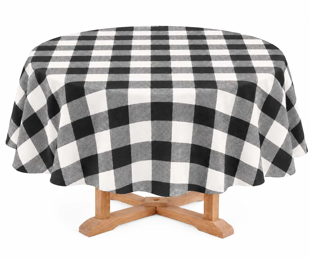Round Black and White Gingham Plaid Linen Tablecloth draped on wooden pedestal table