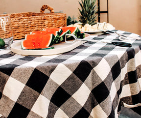 Black and white tablecloth, a striking contrast, lends a sophisticated and monochromatic elegance to your gatherings.
