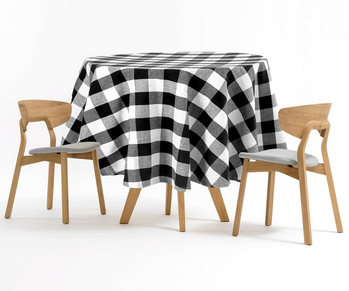 Black round tablecloth, pristine and elegant, complements any tableware and decor effortlessly.
