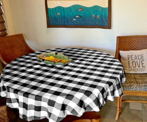Round plaid tablecloth, reminiscent of rustic charm, brings a cozy and homey atmosphere to your table.black round tablecloths