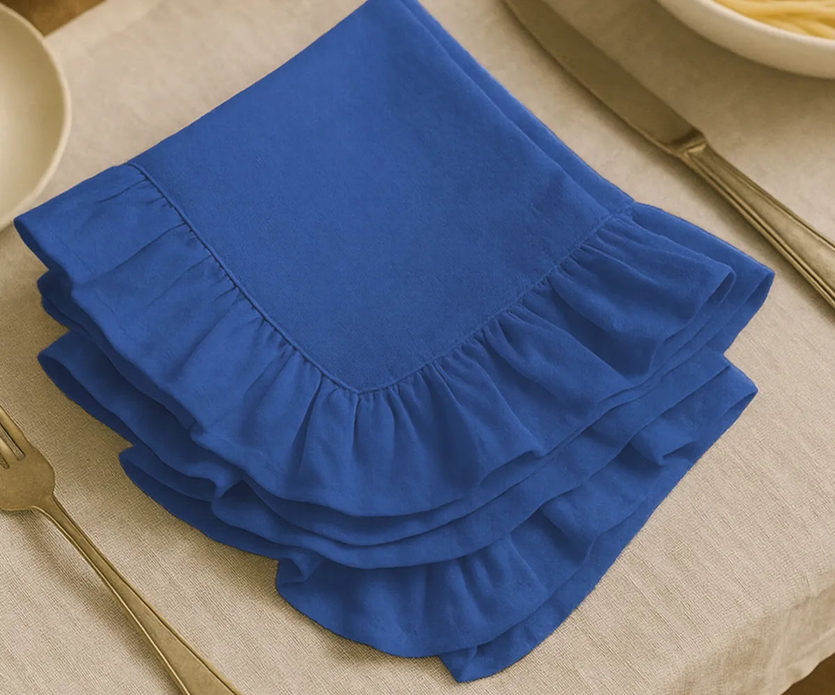 Set of 100% cotton royal blue ruffled edge napkins, soft and washable fabric napkins available in multiple sizes, perfect for farmhouse, rustic, or elegant table settings.