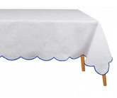 Classic white cotton tablecloth with blue scalloped embroidery crisp, elegant, and durable table linen that adds charm to any dining space. Machine washable embroidered rectangle tablecloth for daily or event use.