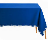 Royal blue cotton rectangle tablecloth with delicate white scalloped embroidery, soft and durable, perfect for elegant dinners, celebrations, and festive gatherings.
