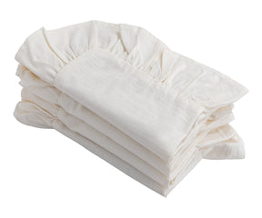 Set of 4 ruffled napkins in natural color, paired with a farmhouse tablecloth.