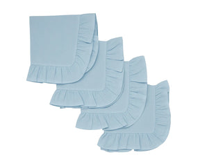 Light blue ruffle cotton cloth napkins set neatly folded on a dining table.