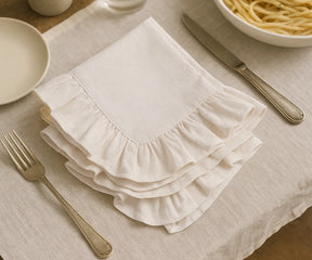 "Set of natural cotton ruffle edge napkins in farmhouse style, soft 100% cotton cloth napkins with delicate ruffled trim, perfect for rustic weddings, dinner parties, and everyday table decor.