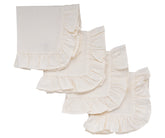 Ruffle edge natural cotton napkins styled on a rustic wooden dining table.