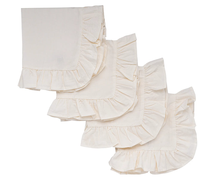 Ruffle edge natural cotton napkins styled on a rustic wooden dining table.