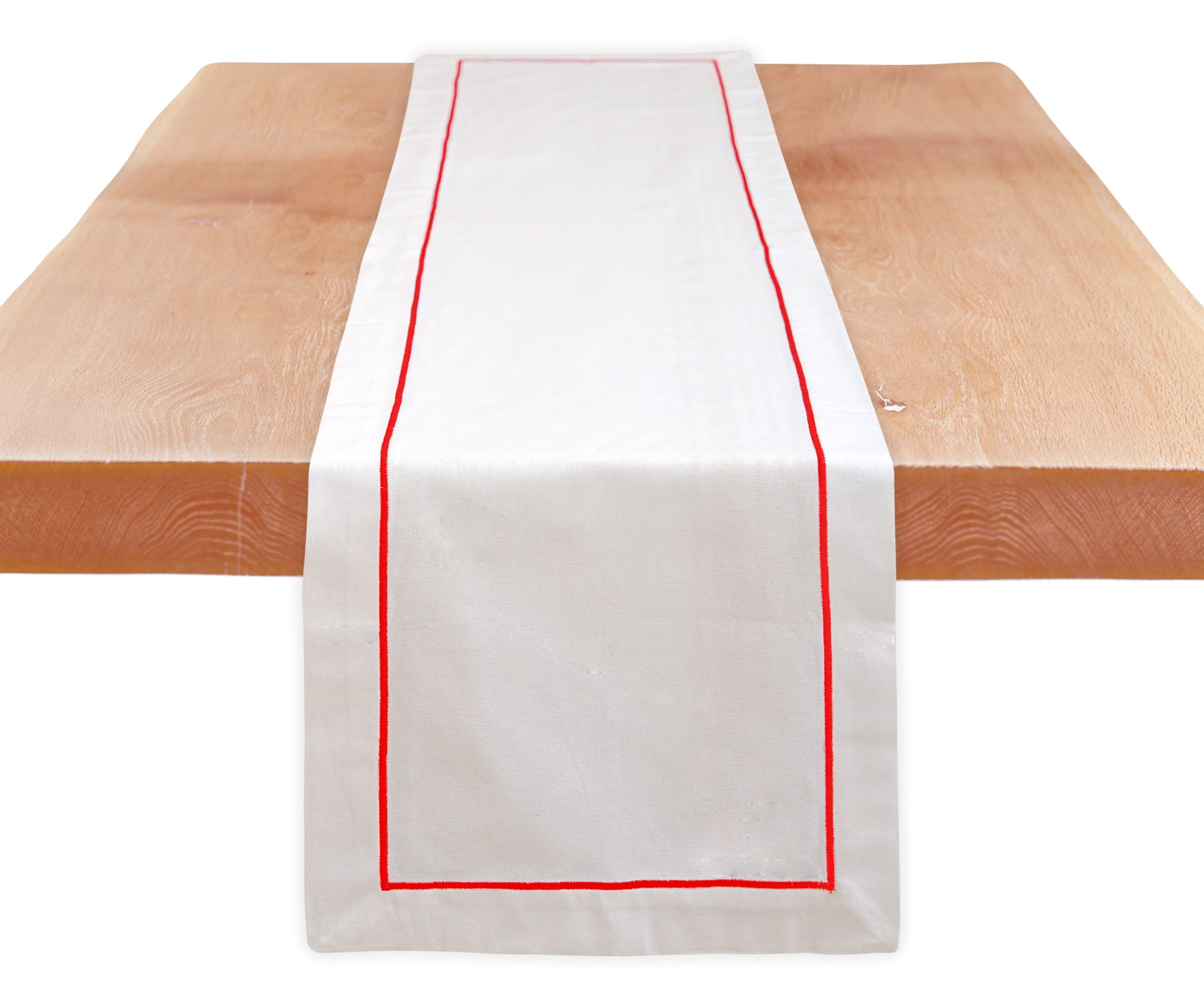 Cotton table runner featuring timeless line embroidery.