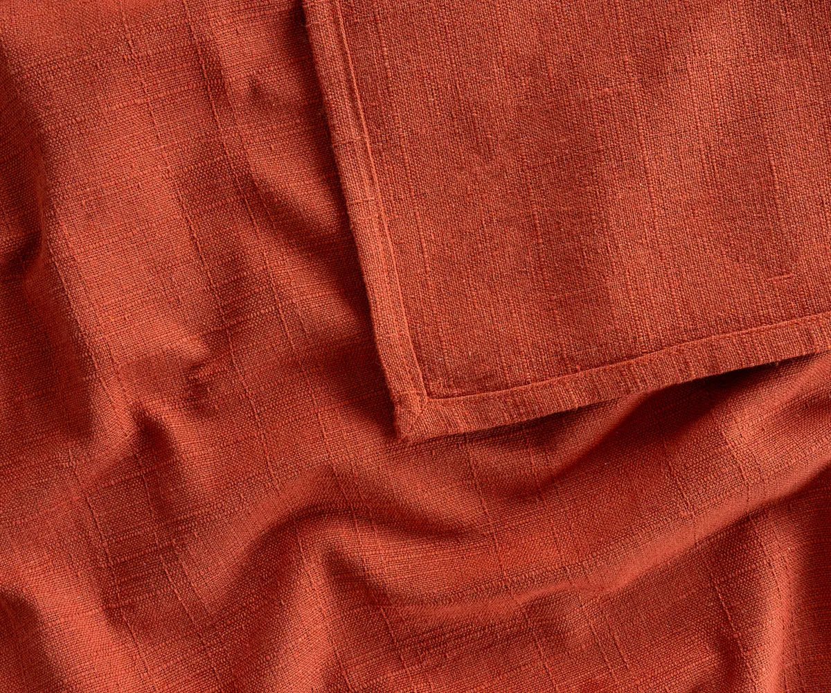 Soft, breathable rust-colored cotton tablecloth in multiple sizes, eco-friendly and long-lasting, ideal for weddings, holiday dinners, or casual family meals.