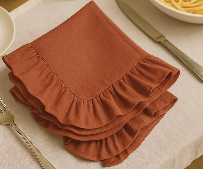 Rust cotton ruffle edge dinner napkins, reusable and absorbent cloth napkins for weddings, parties, holidays, and everyday rustic farmhouse dining table décor.