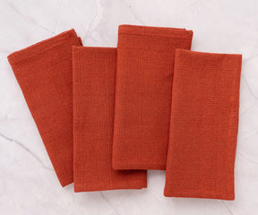 Set of 12 rust cloth napkins in 100% cotton, machine washable, soft, and durable for family dinners and restaurant use