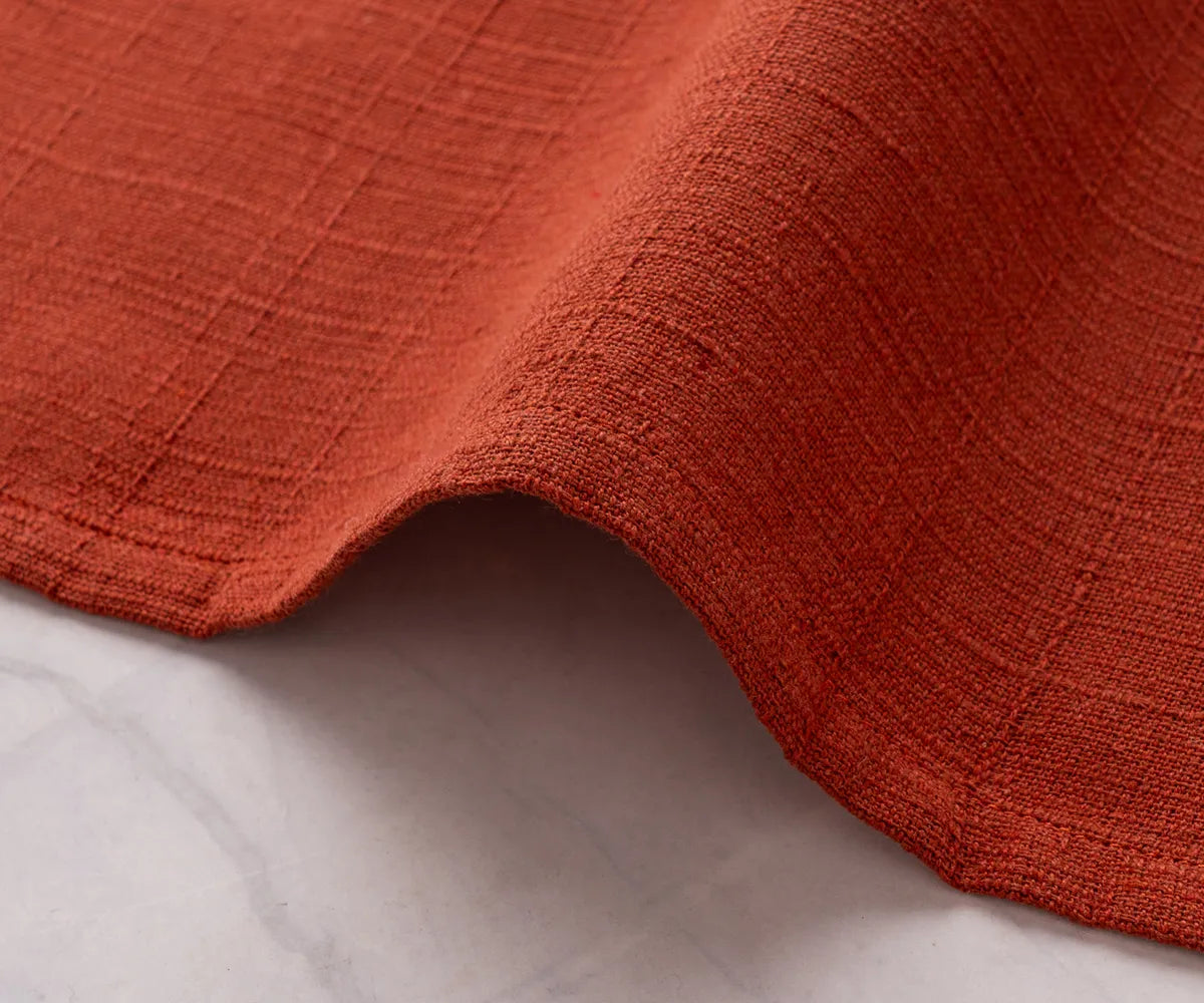 Rust cloth napkins designed for weddings, crafted from soft cotton fabric, adding warmth and elegance to reception tables