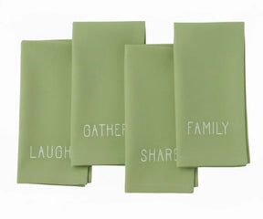 Sage green cotton dinner napkin with fine white embroidery — elegant and natural addition to farmhouse dining decor.