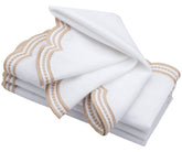 Beige scallop napkins displayed in a cozy, farmhouse-style kitchen