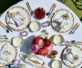 Stylish beige scallop napkins adding a touch of charm to a modern farmhouse dining table.
