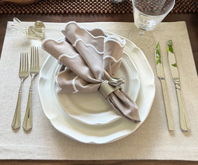 Beige scallop napkins adding elegance to a bridal shower table setup