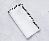 Set of black cotton napkins with scalloped trim for wedding or event décor