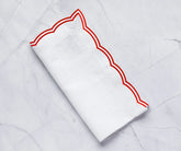 Set of red cotton napkins with scalloped edges perfect for parties or dinners