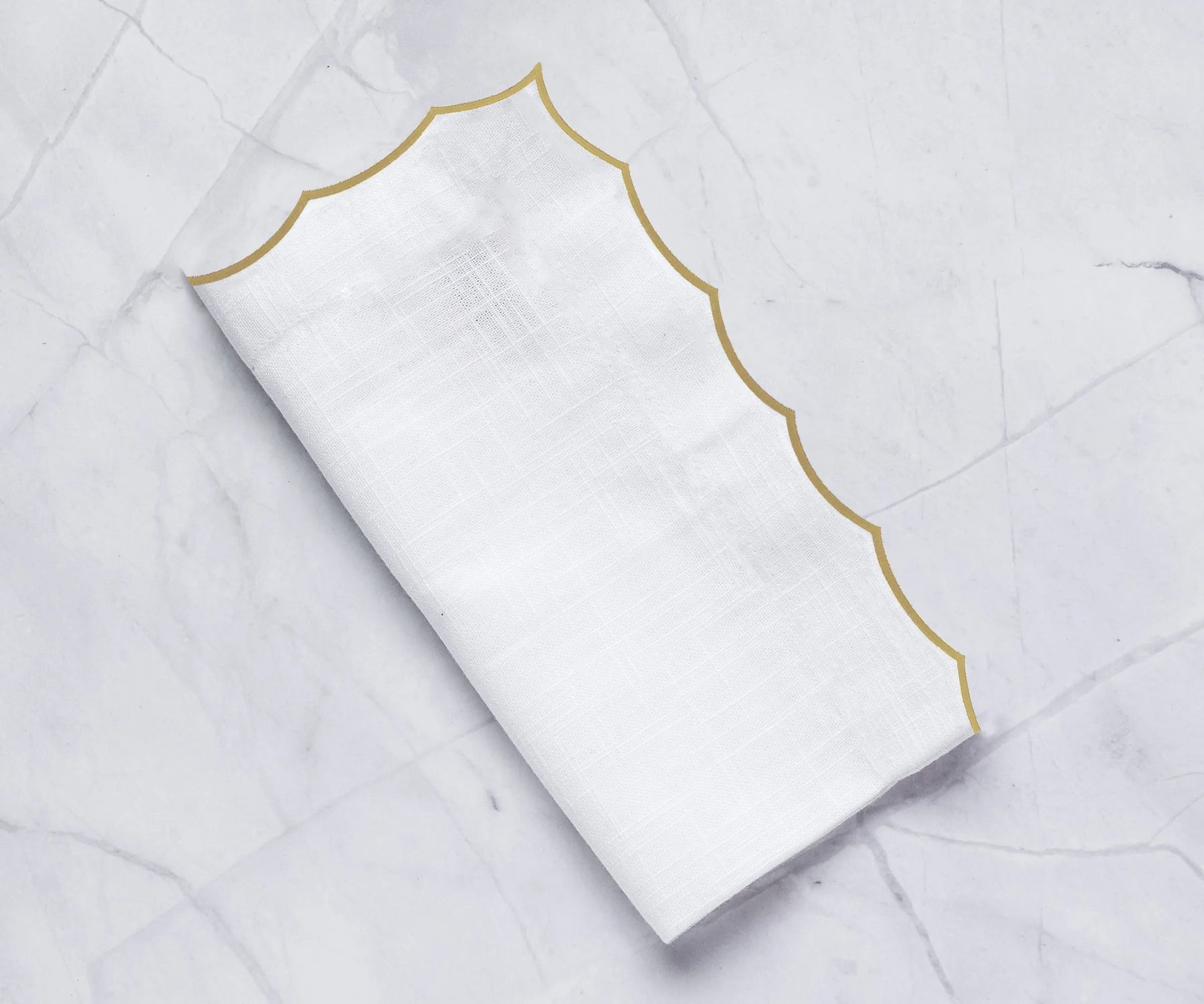 Reusable 100% cotton embroidered napkins designed for weddings, dining settings, and elevated home table styling.