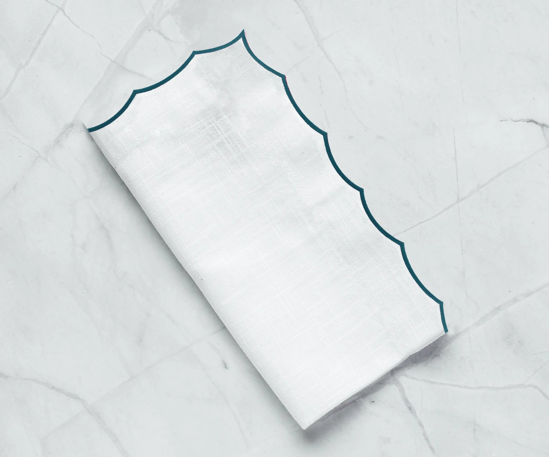 Luxury cotton napkins featuring delicate embroidery, ideal for formal dining settings.