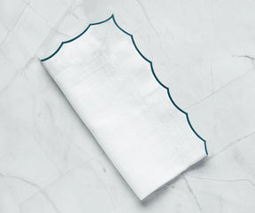 Luxury cotton napkins featuring delicate embroidery, ideal for formal dining settings.