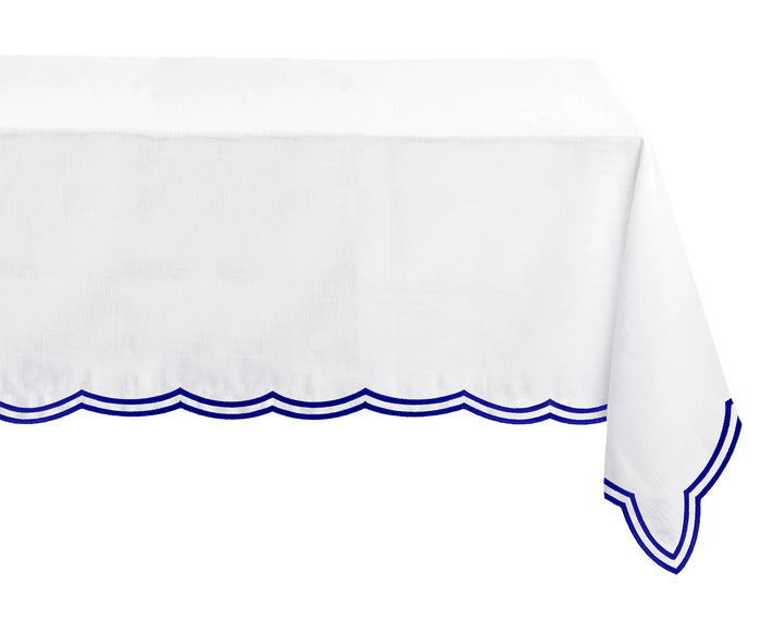 Rich royal blue embroidered tablecloth with a crisp, tailored rectangle shape and soft scallops