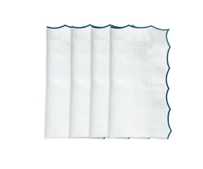 Elegant embroidered cotton napkins with scalloped edges for wedding and event table décor.