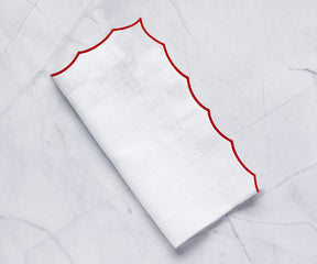 Classic cotton napkins with detailed scalloped edging for timeless table presentations.