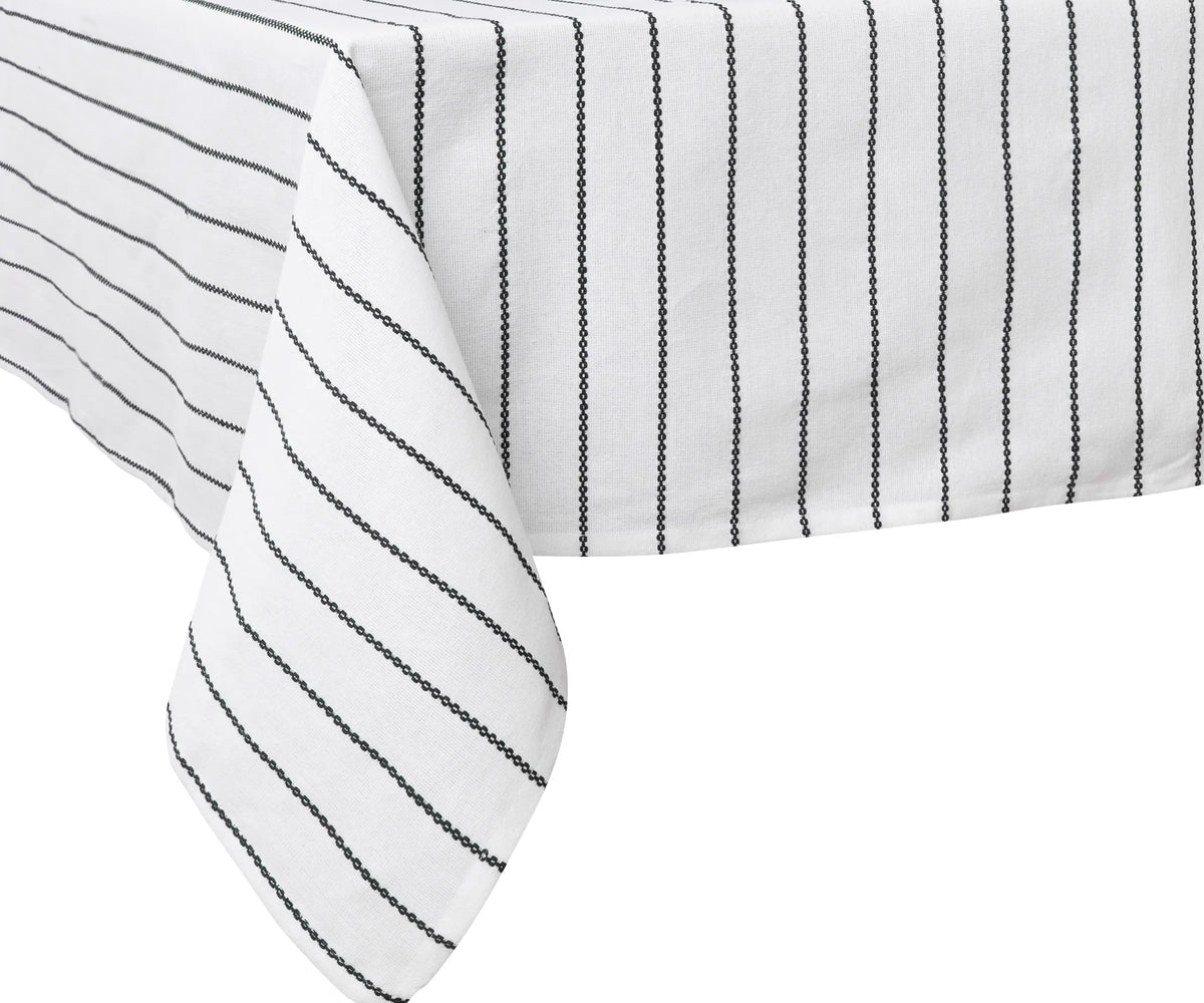 Bulk set of black and white cloth tablecloths folded neatly