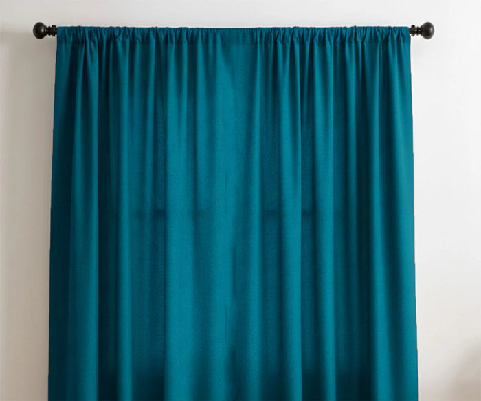 Teal curtains hanging in a bright living room with elegant teal drapes curtains and modern window decor
