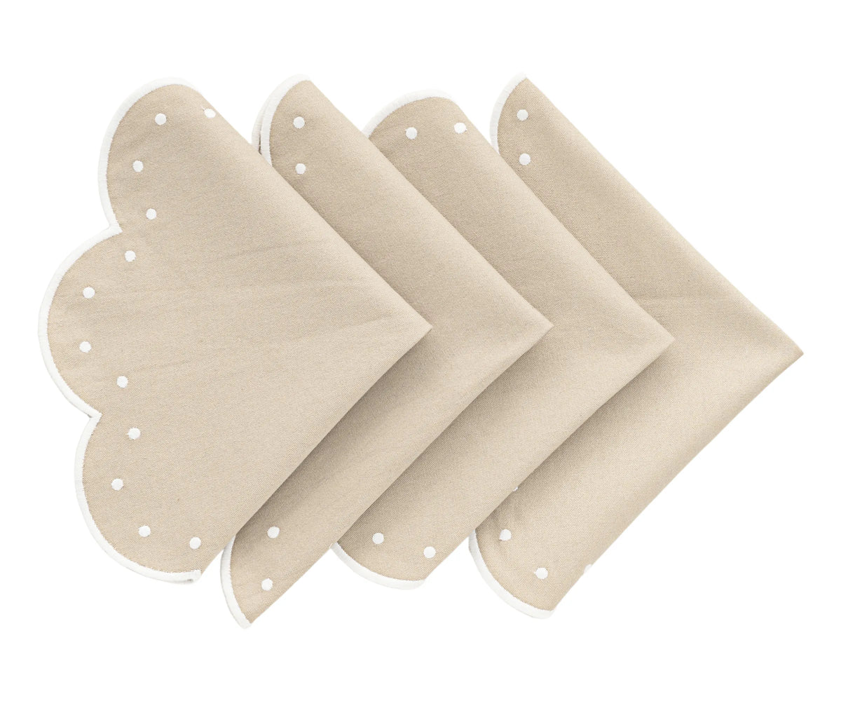 Set of four beige cotton placemats with scalloped edges