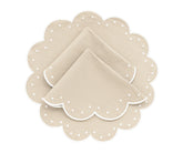 Elegant polka dot placemat close-up with stitched scallop detail