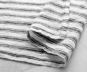 Add a touch of elegance to your bathroom with our striped linen towel, a stylish accent that enhances the aesthetic of your space.