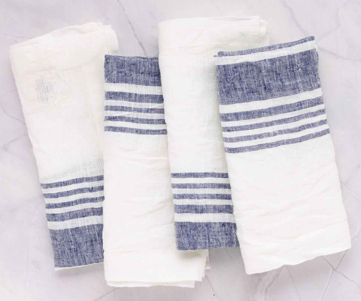 Set of four linen dinner napkins with blue stripes