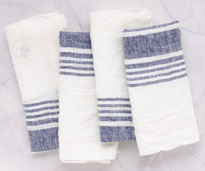 Set of four linen dinner napkins with blue stripes
