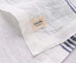 Premium white linen napkin adorned with blue stripes